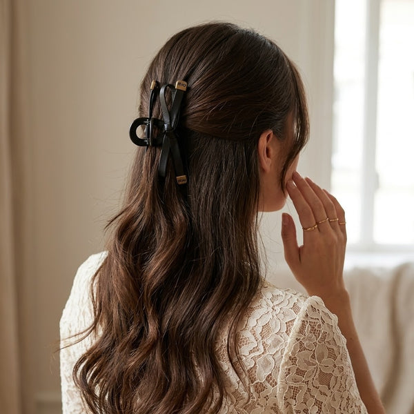 Close-up of the Leather Bow Miu Hair Claw showing bow detail