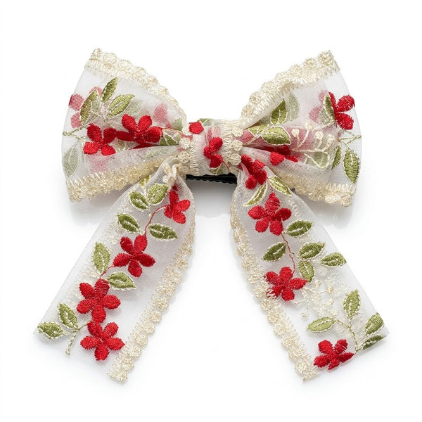 Close-up of the Dainty Flower Organza Bow Clip showing floral motif