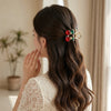 Close-up detail of the Shiny Cherry Mini Hair Claw hair claw clip