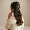 Close-up of the Pearl Embellished Zipper Hair Claw showing pearl detail