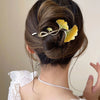 Close-up of the Kopida Ginkgo Leaf Twist Clip showing leaf motif