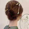 Close-up detail of the Emerald Bamboo Breeze Hair Stick hair clip