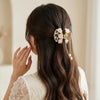 Close-up of the Embellished White Tulip Hair Claw showing tulip motif