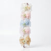 Close-up of the Rose Organza Hair Bow Clips showing rose motif