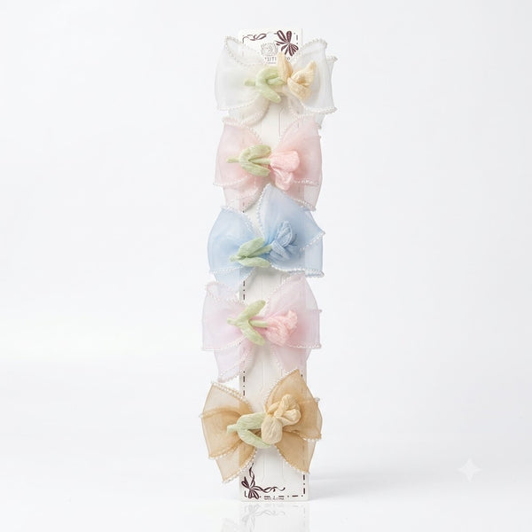 Close-up of the Rose Organza Hair Bow Clips showing rose motif