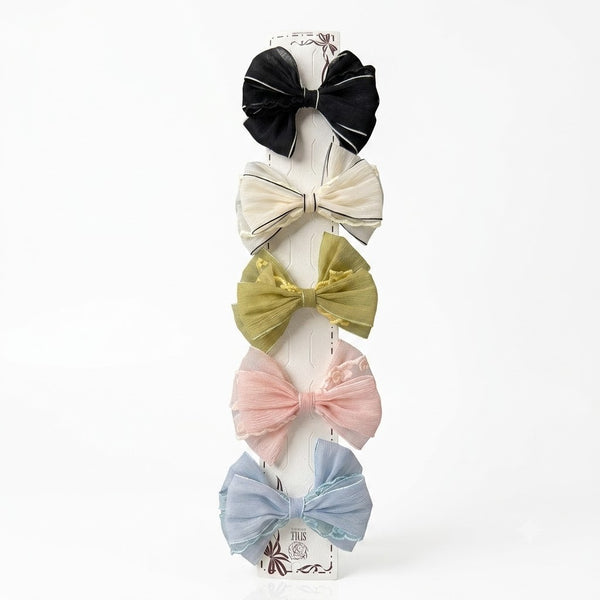 Close-up of the Embroidered Fabric Bow Clip showing bow detail