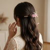 Close-up of the Pink Double Flower Fringe Hairpin showing floral motif