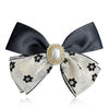 Elegent Pearl Stud B&W Bow Clip