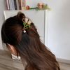 Close-up of the Studded Tulip Pearl Hair Clip showing tulip motif