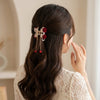Close-up of the Red Rose Hair Claw Clip showing rose motif