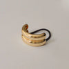 Close-up detail of the Wide Double Arch Metal Ponytail Hair Tie | Gold