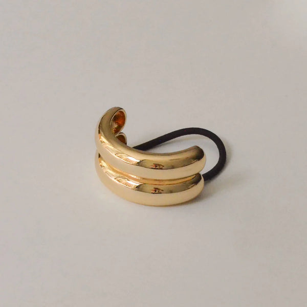 Close-up detail of the Wide Double Arch Metal Ponytail Hair Tie | Gold