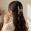 Close-up of the Pearl Blossom Hair Clip showing pearl detail