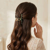 Close-up detail of the Twisted Embellished Green Hair Clip hair claw clip