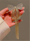 Close-up of the Dreamy Studded Butterfly Tassel Hair Bow Clip showing butterfly motif