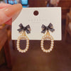 Bow gold-toned oval drop earrings