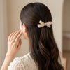 Pearl Studded Bow Hair Clip hair bow worn on model – styled for women